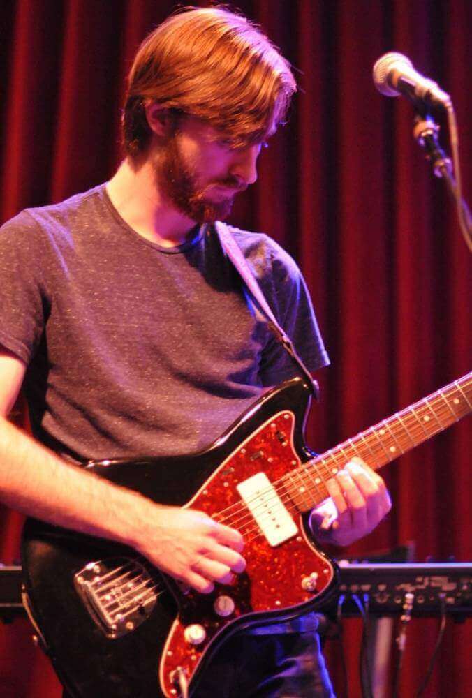 Guitar teacher performing image